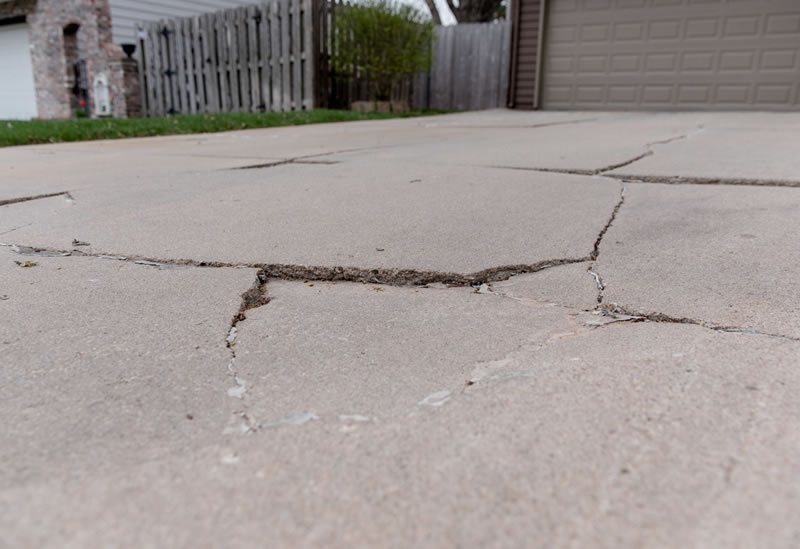 small cracks over a large driveway